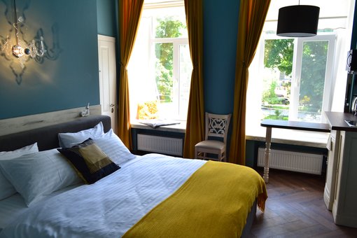 A room with a double bed in the Michel hotel in Odessa. Reserve a room for the promotion.