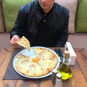 Pizza at the staker&#39;s restaurant in dnipro. order with a discount